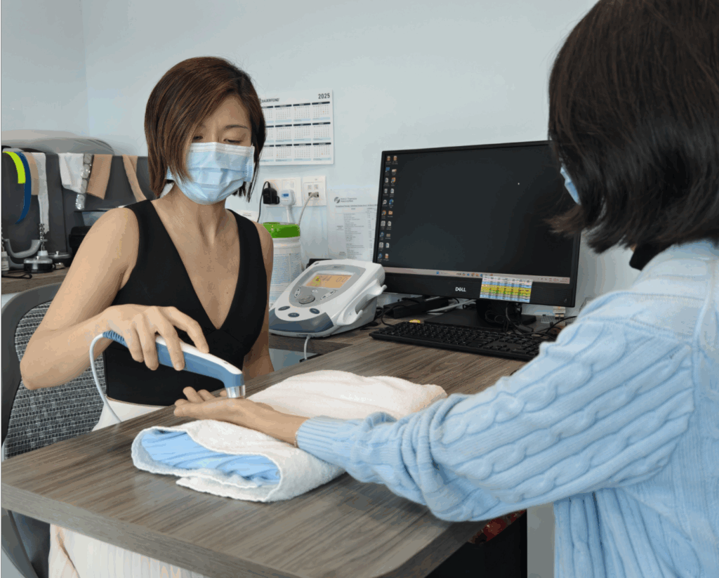 Therapist applying hand treatment at Hand Therapy Associates